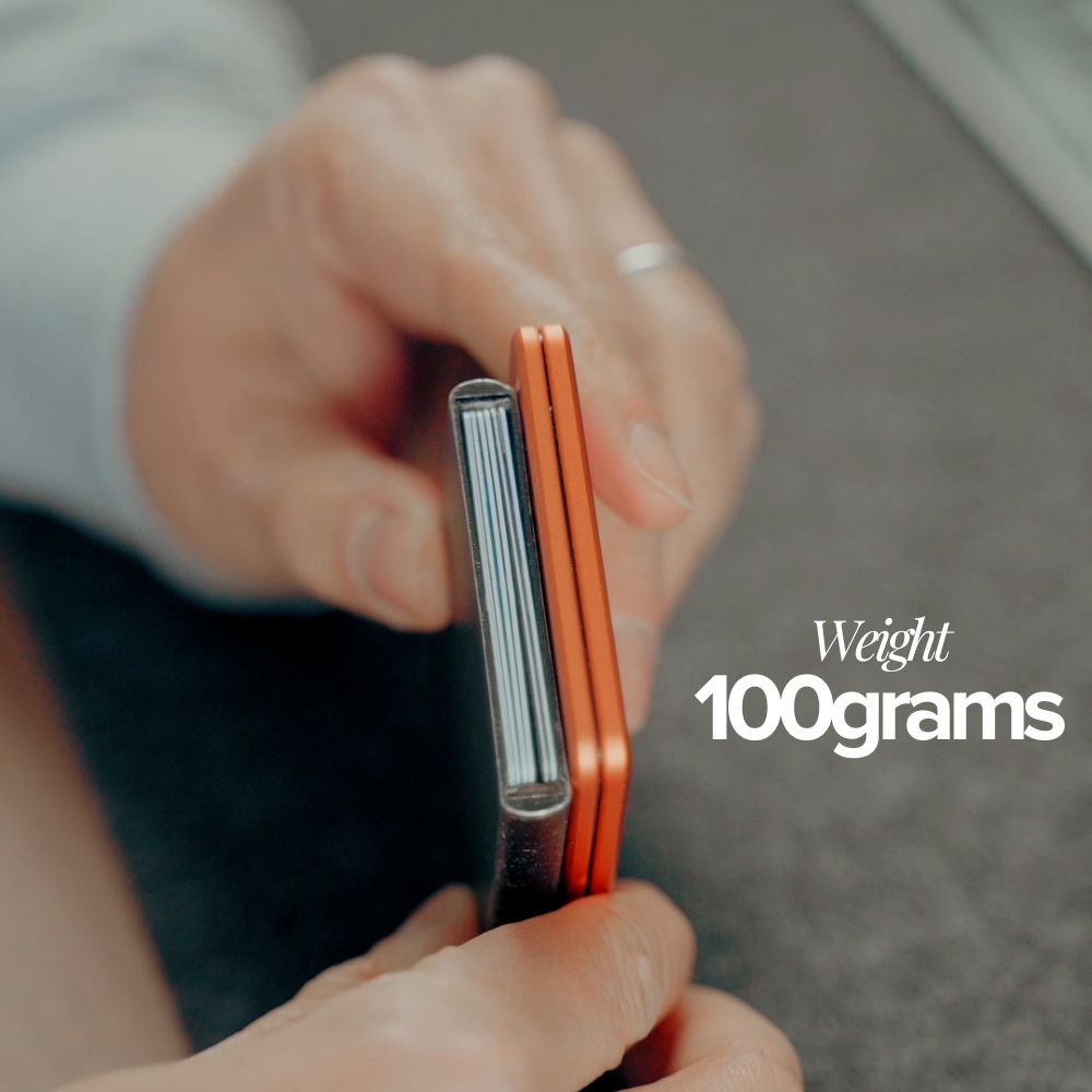 Two slim electronic devices being held by a person with text indicating weight of 100 grams.