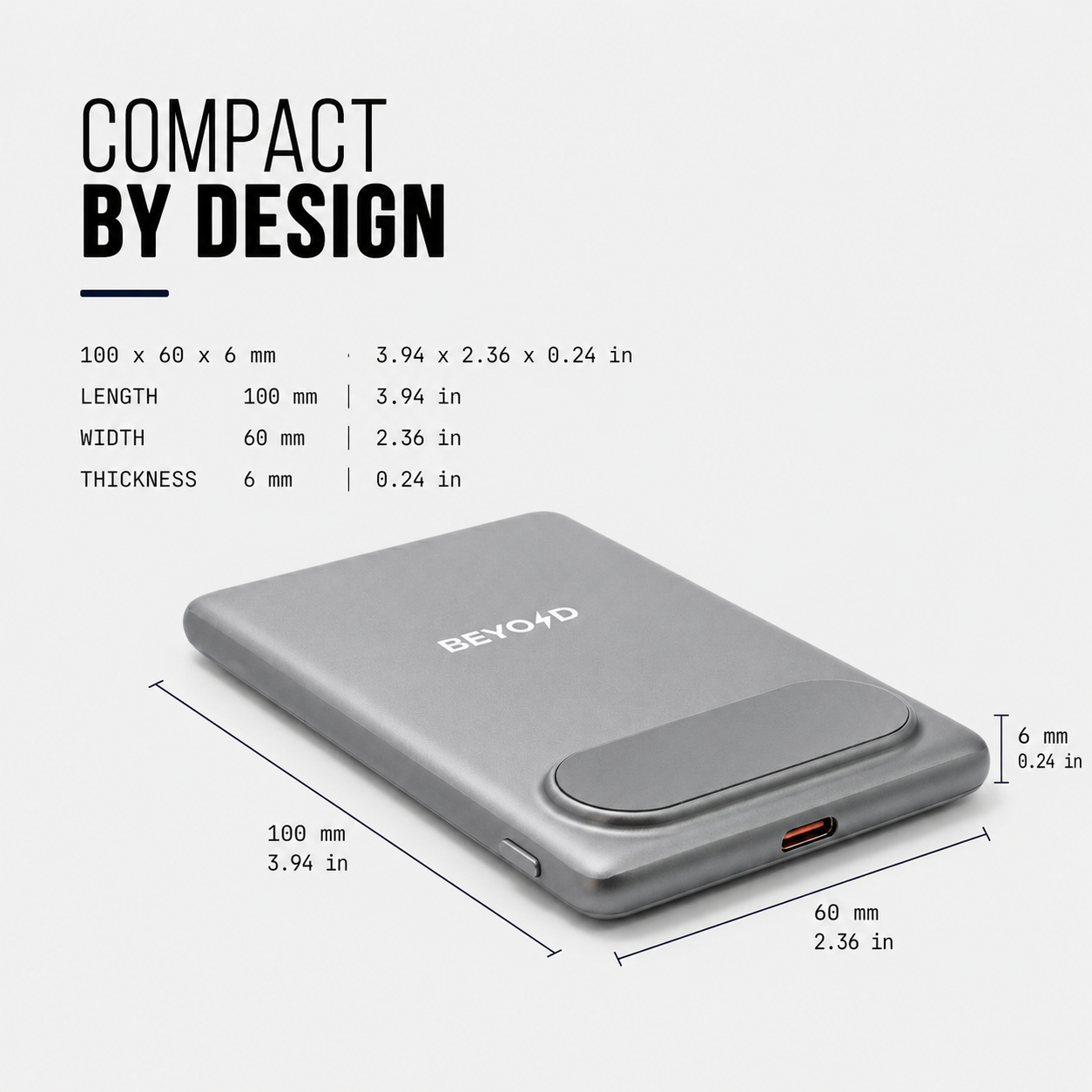 A silver portable power bank shown on a light gray background with text and dimension lines indicating its size: 100 x 60 x 6 mm (3.94 x 2.