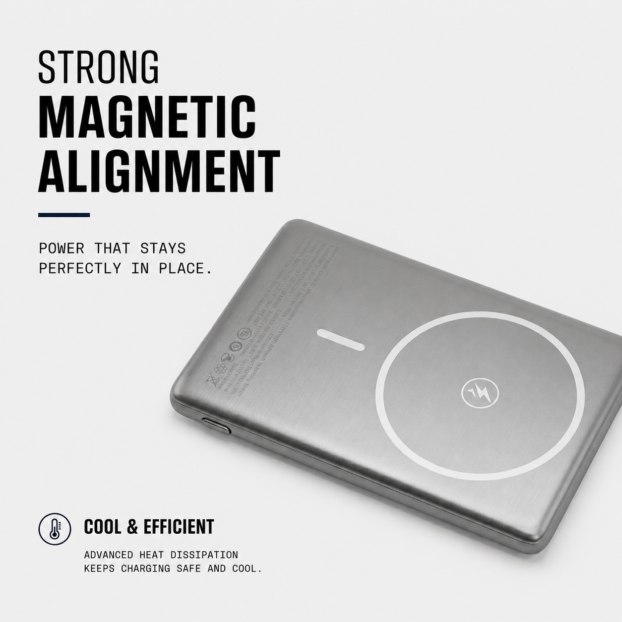 A silver rectangular electronic device with rounded corners, shown at an angle on a light gray background. The device features a circular magnetic alignment indicator on the top surface and is accompanied by marketing text highlighting its strong magnetic alignment and cool, efficient performance.